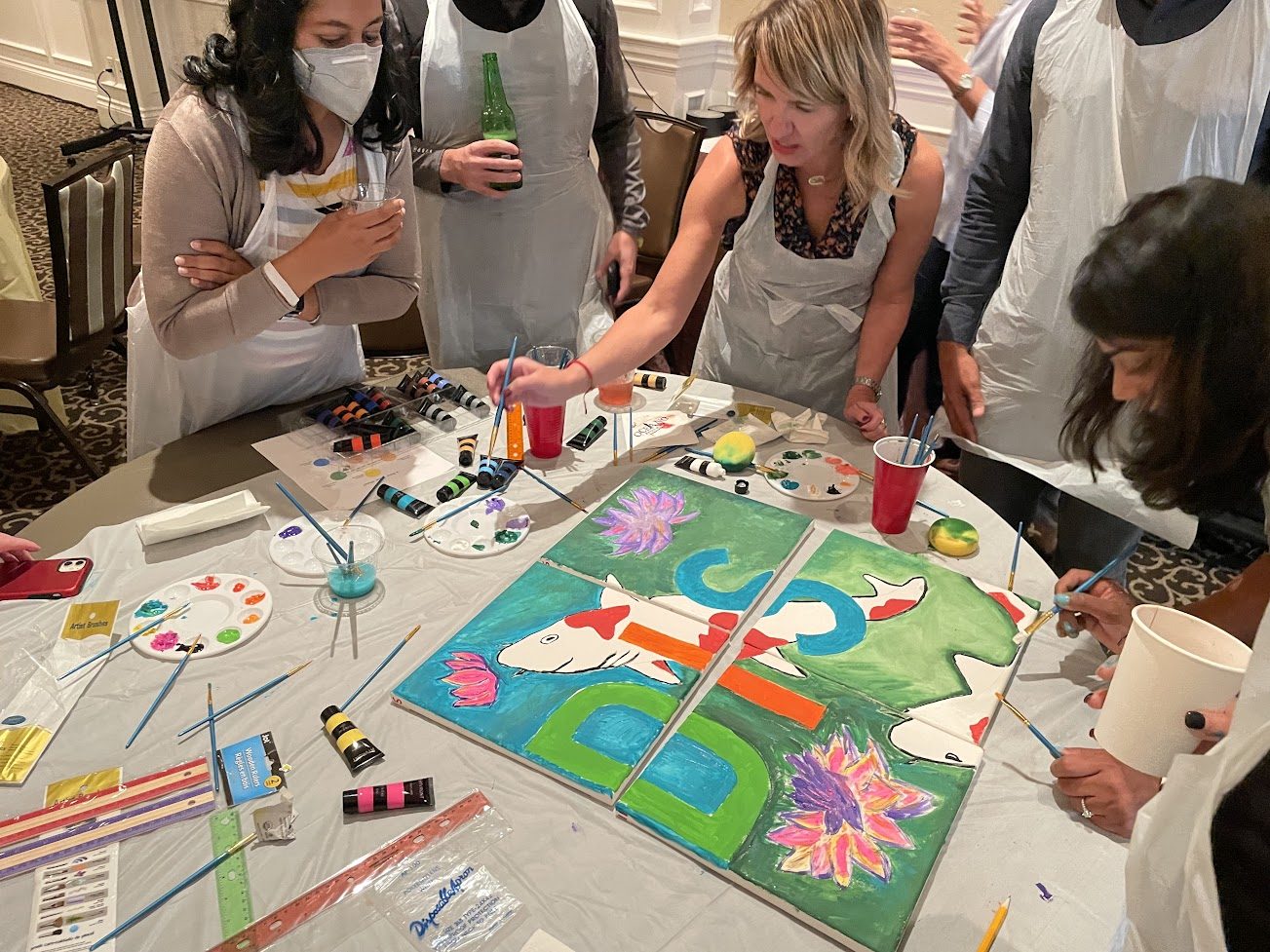 Artists collaborating on bold colorful designs