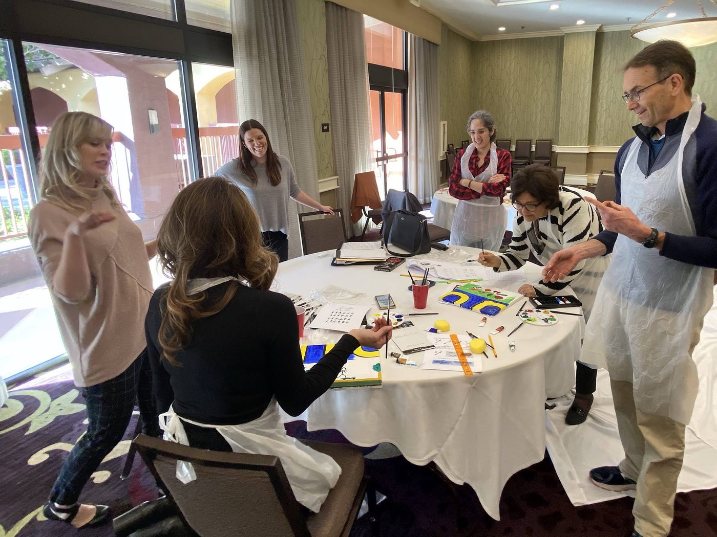 Participants collaborating over their art materials